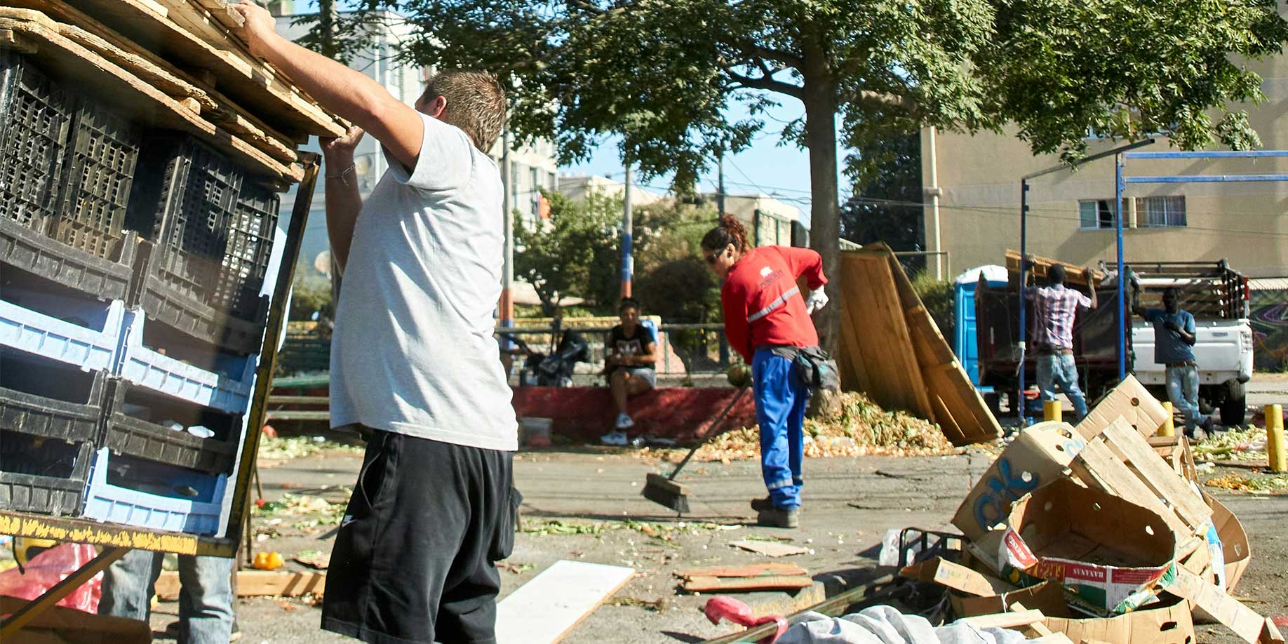 People cleaning up after a natural disaster