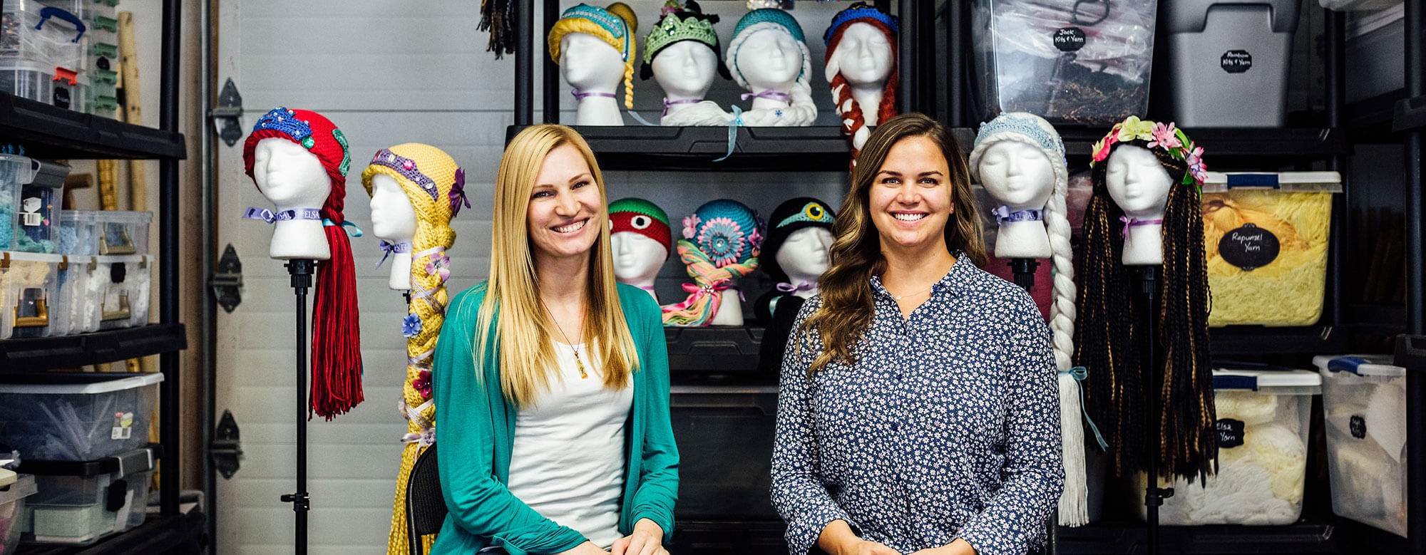 Two women sitting and smiling
