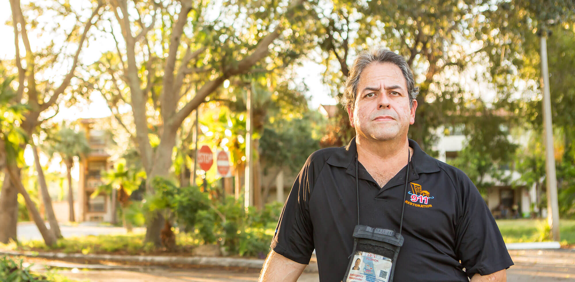 Man standing in front of trees