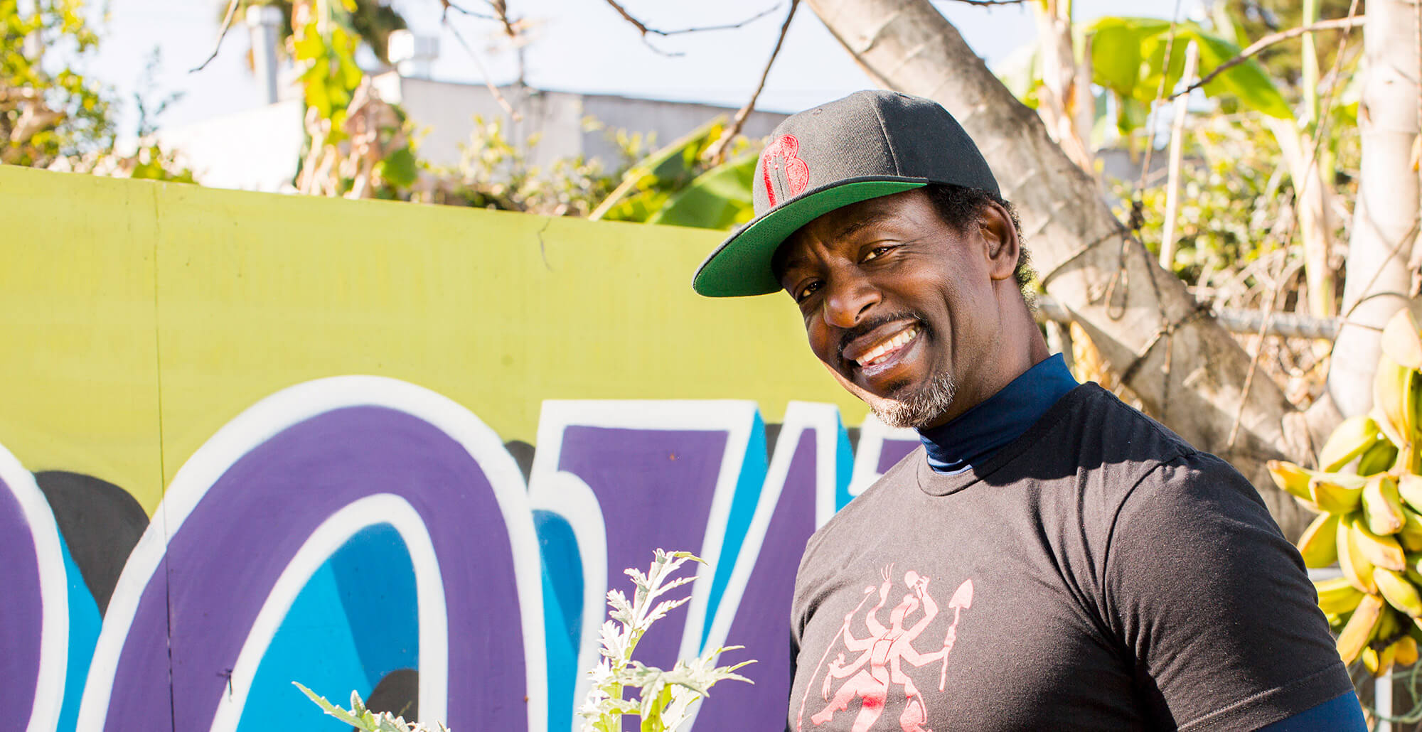 Man wearing a baseball cap and smiling