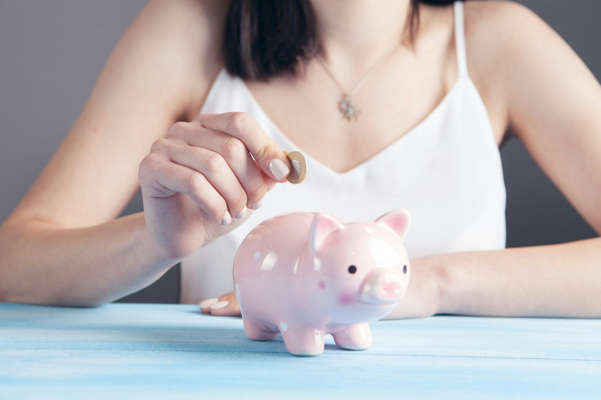 Woman with a piggy bank