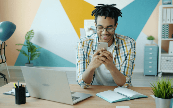 Man on a phone and laptop