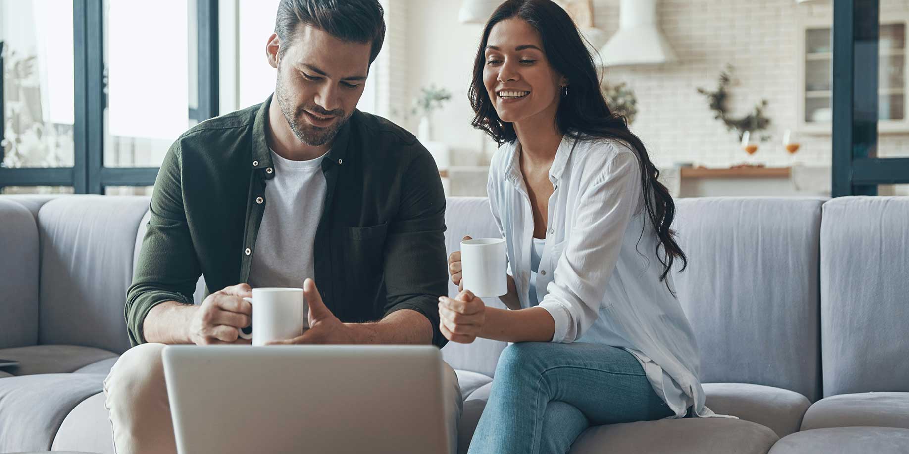A couple learning about donor advised funds on a laptop