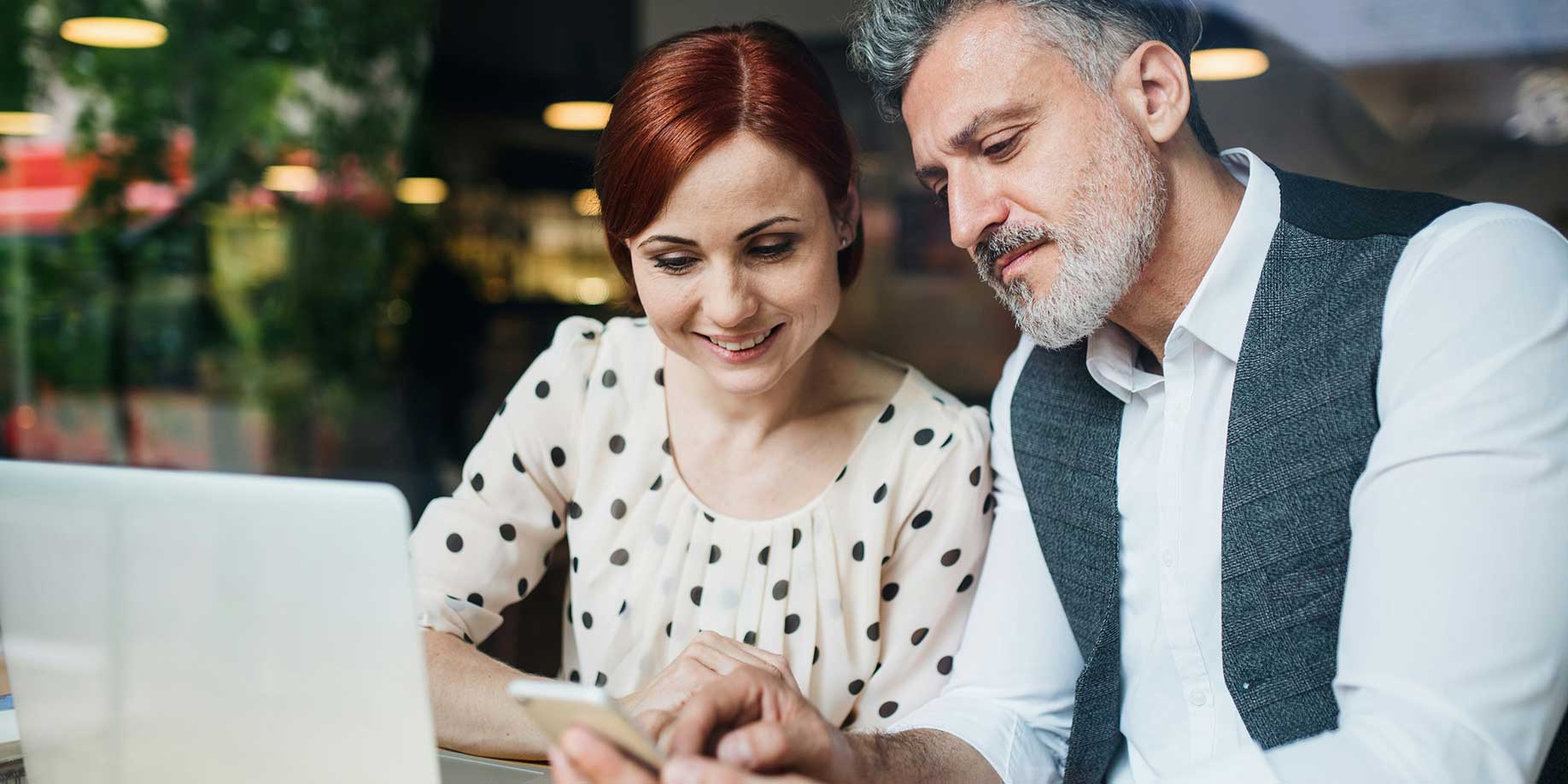 A couple deciding which charities to donate to