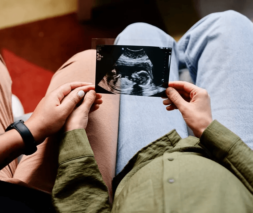 A couple holding an ultrasound