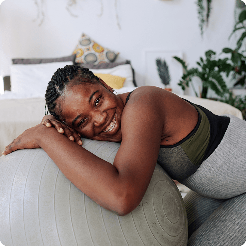 A pregnant person smiling