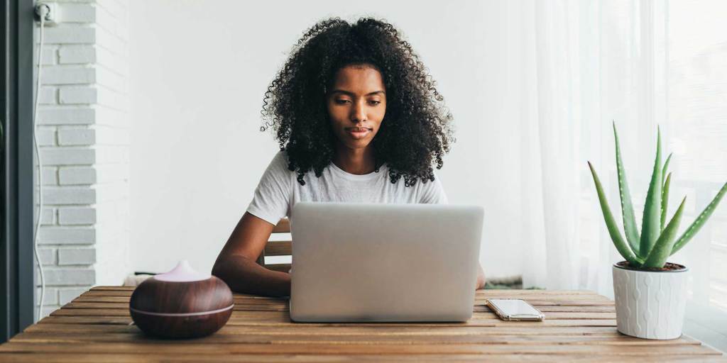 Woman using a laptop to update her fundraiser