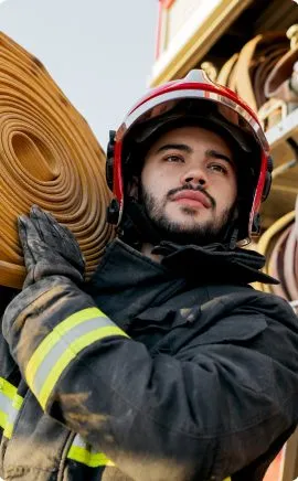 firefighter with a firehose