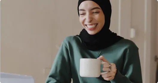 Woman smiling with a mug