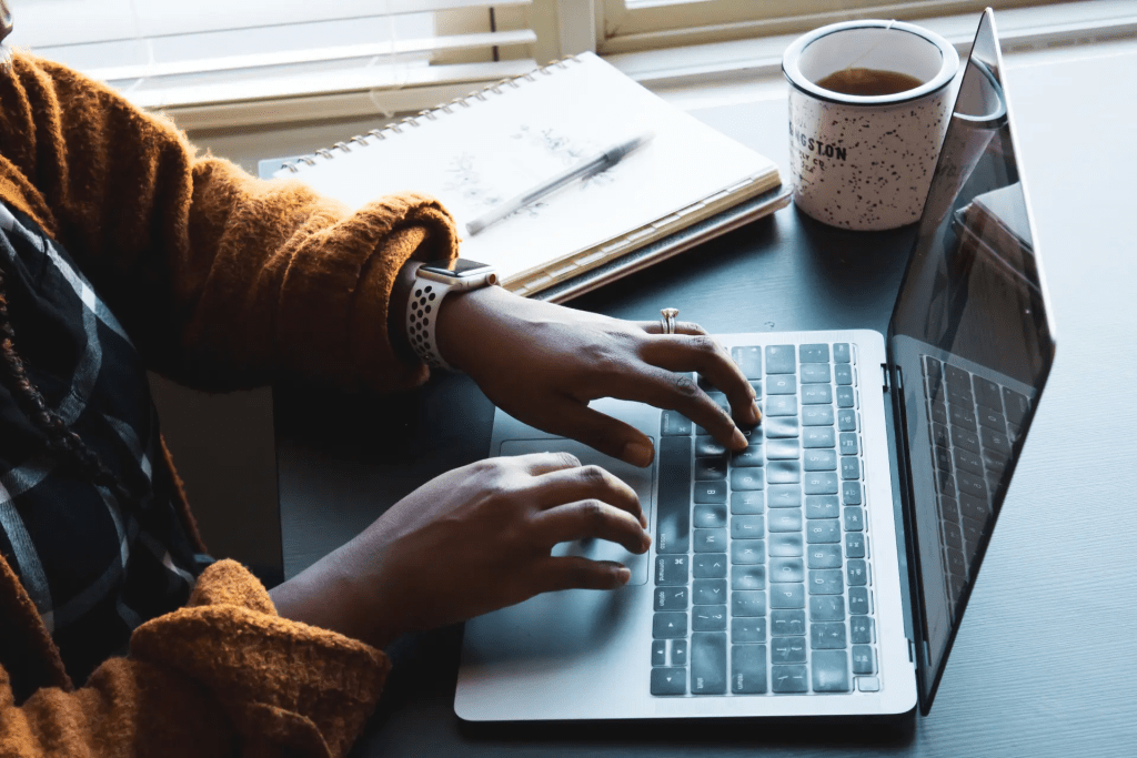woman typing on a laptop